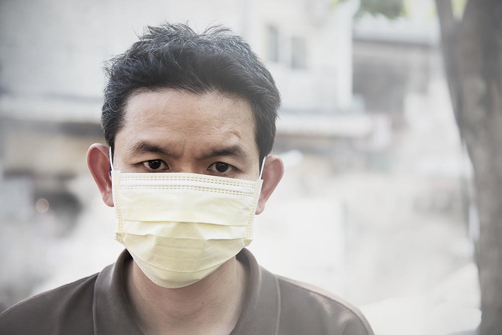 man wearing mask protect fine dust air pollution environment